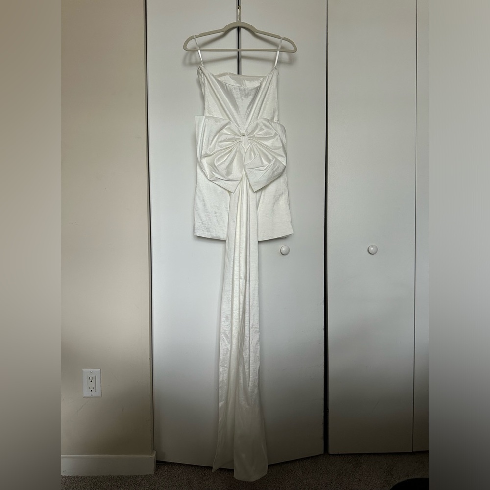 White mini dress with large bow train